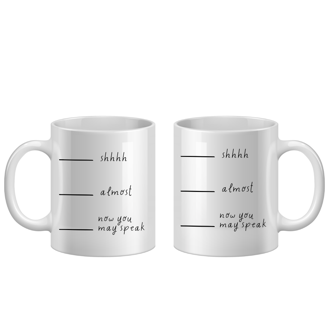 Two white mugs with text on a white background