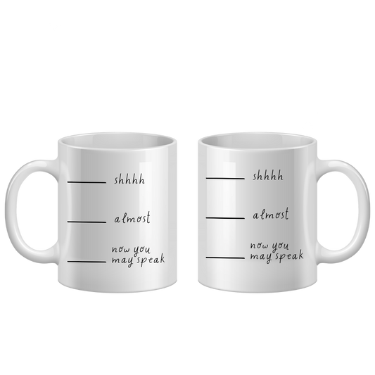 Two white mugs with text on a white background