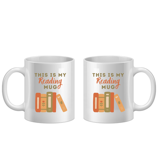 Two white mugs with 'This is my reading mug' text and book illustrations on a white background