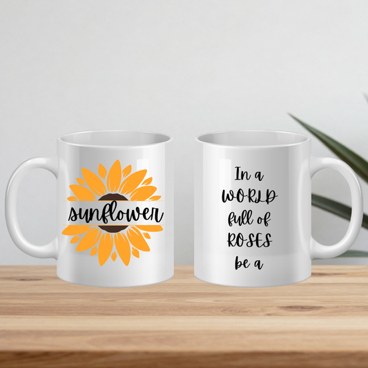 Two white mugs with sunflower design and text on a wooden surface.