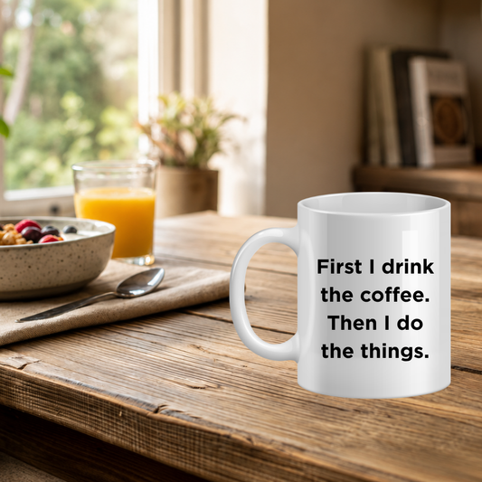 White mug with text on a wooden table with breakfast items