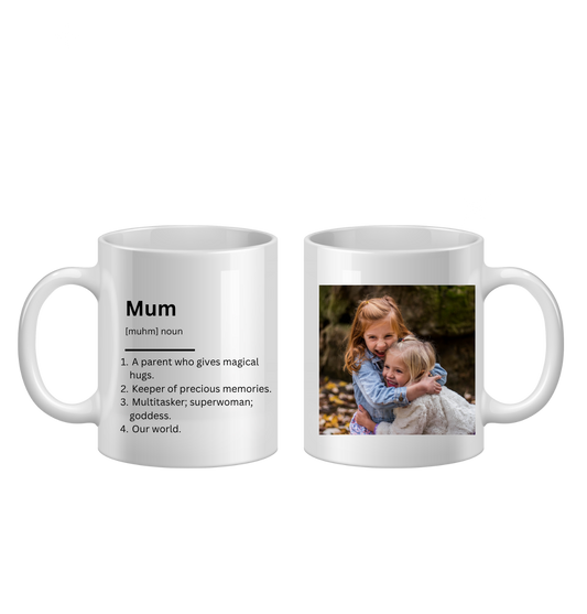 Two white mugs, one with a definition of 'Mum' and the other with a photo of two children hugging.