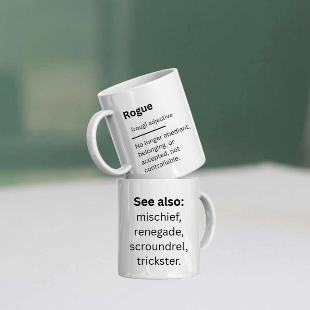 Two white mugs with black text on a light surface and green background