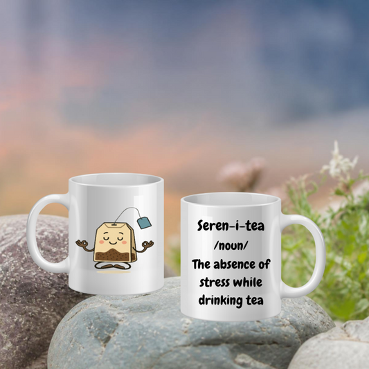 Two mugs with tea-themed designs on a blurred natural background